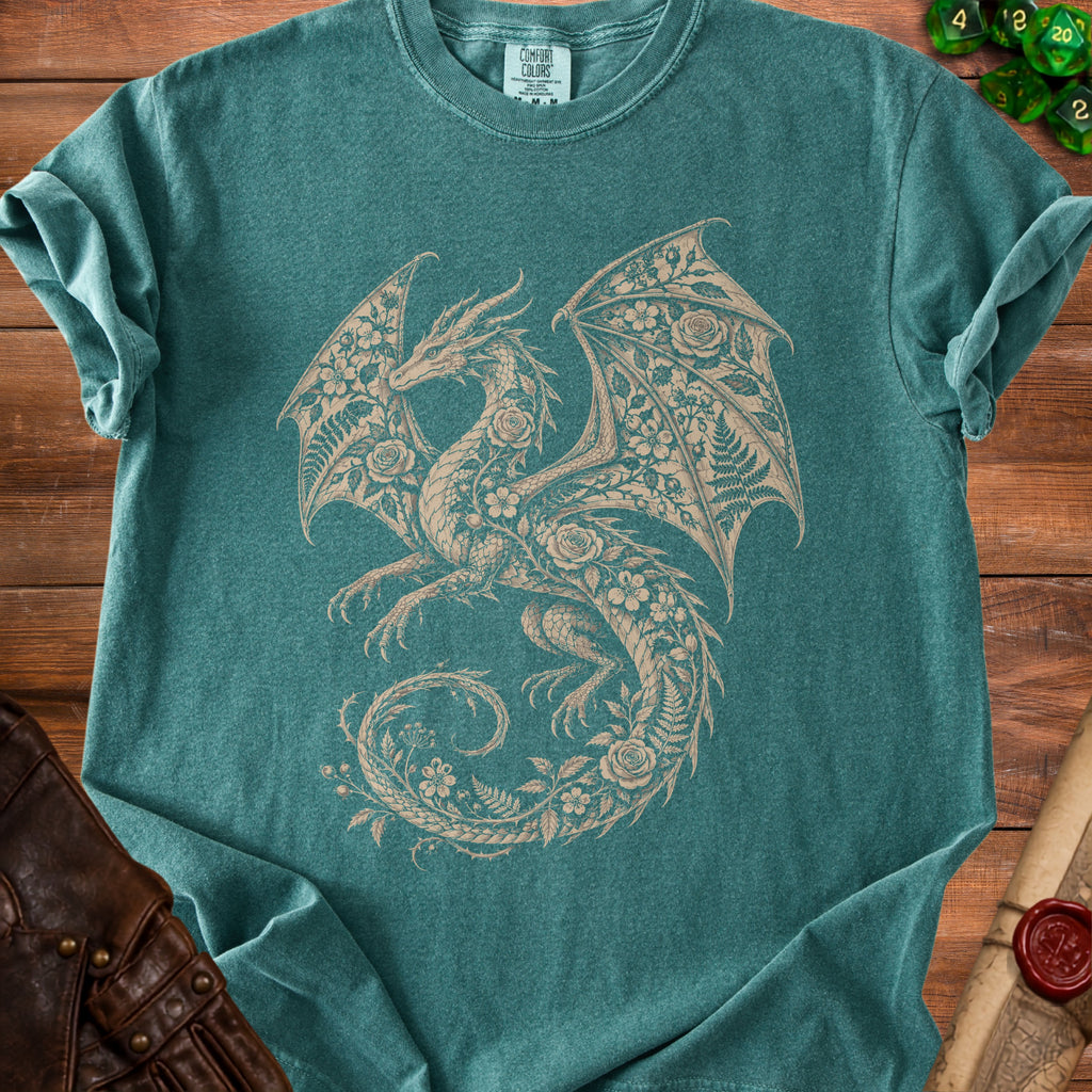 Teal t-shirt with a beige floral dragon graphic and "Comfort Colors" tag.