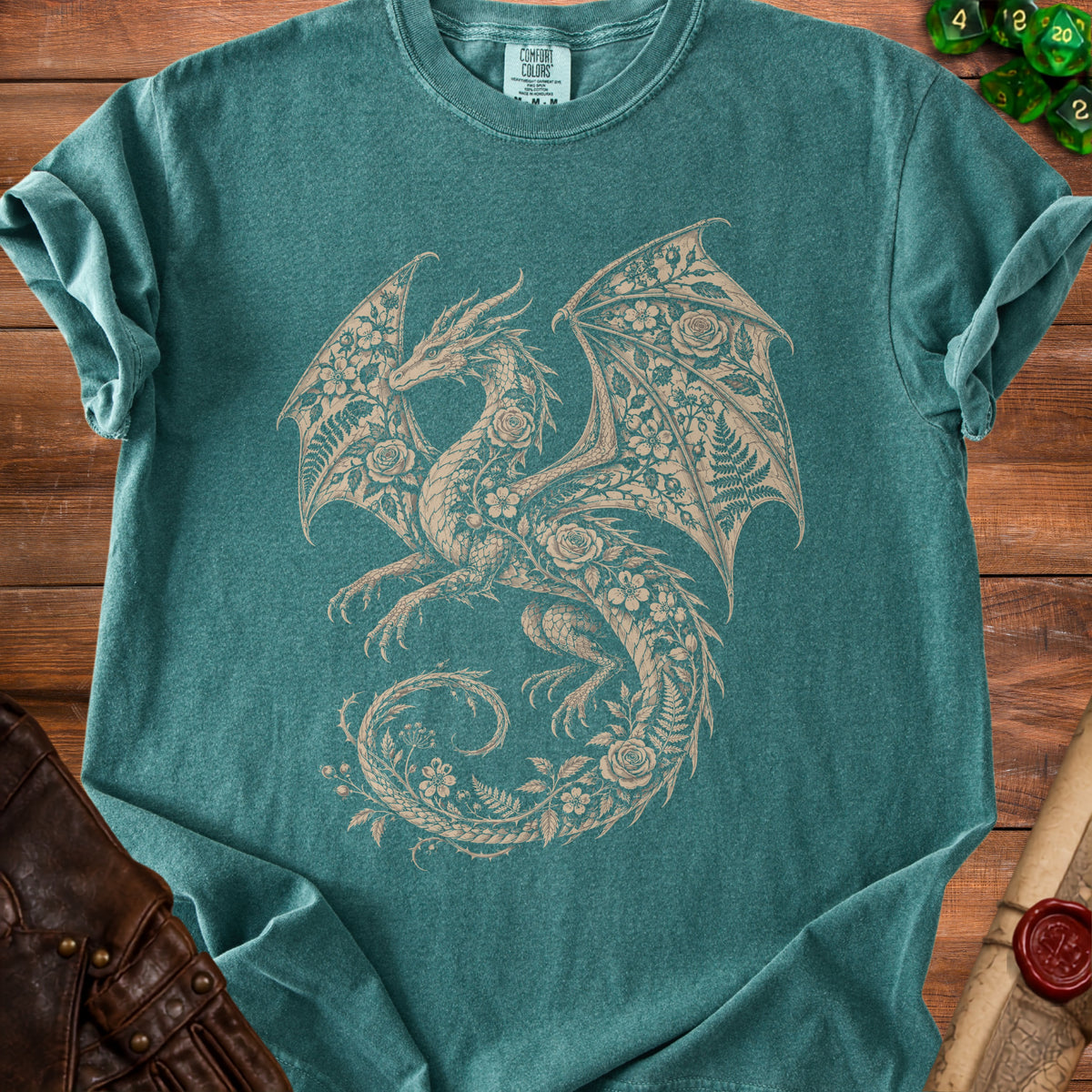 Teal t-shirt with a beige floral dragon graphic and "Comfort Colors" tag.