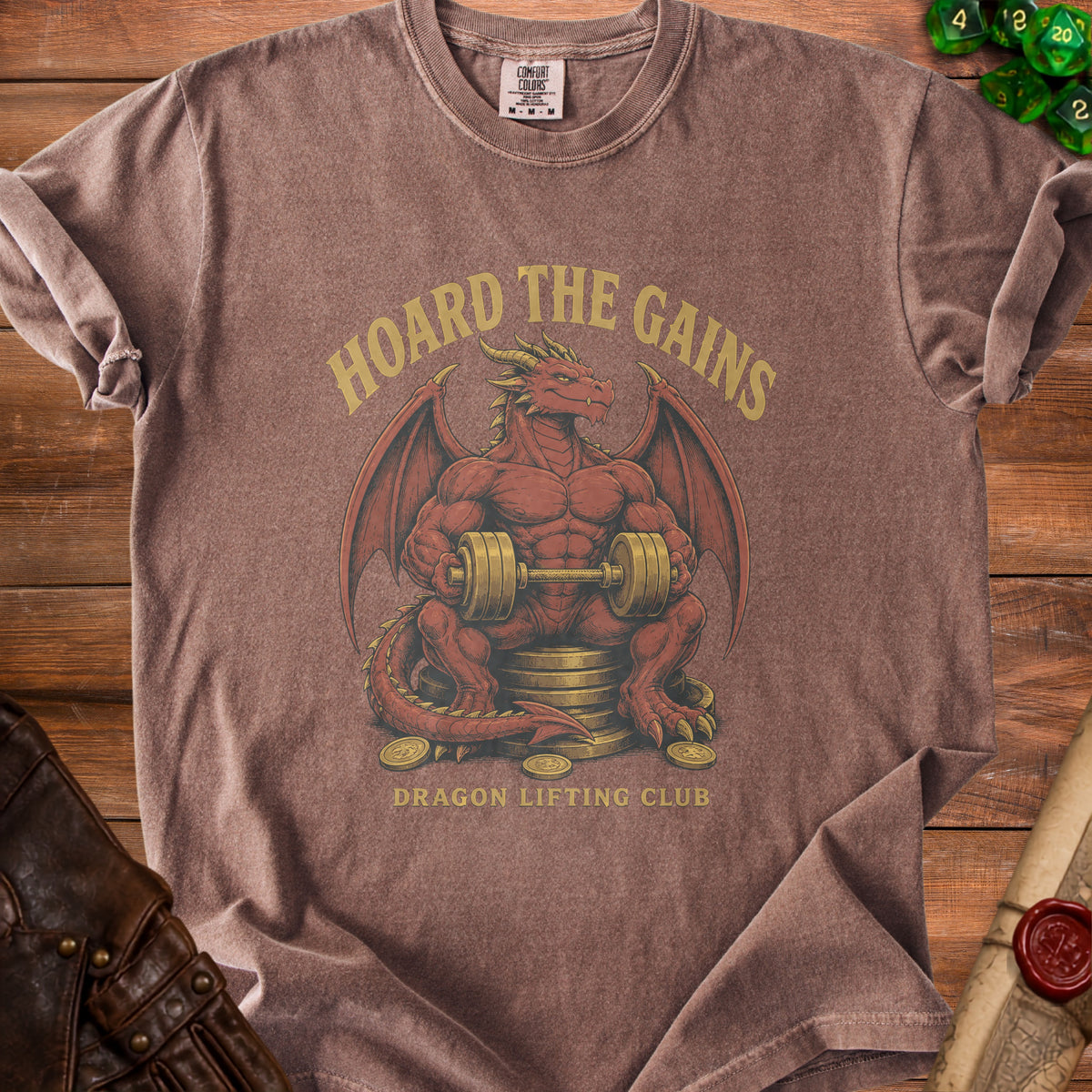 Brown crewneck t-shirt featuring a muscular red dragon holding a dumbbell, with text that reads Hoard The Gains Dragon Lifting Club.
