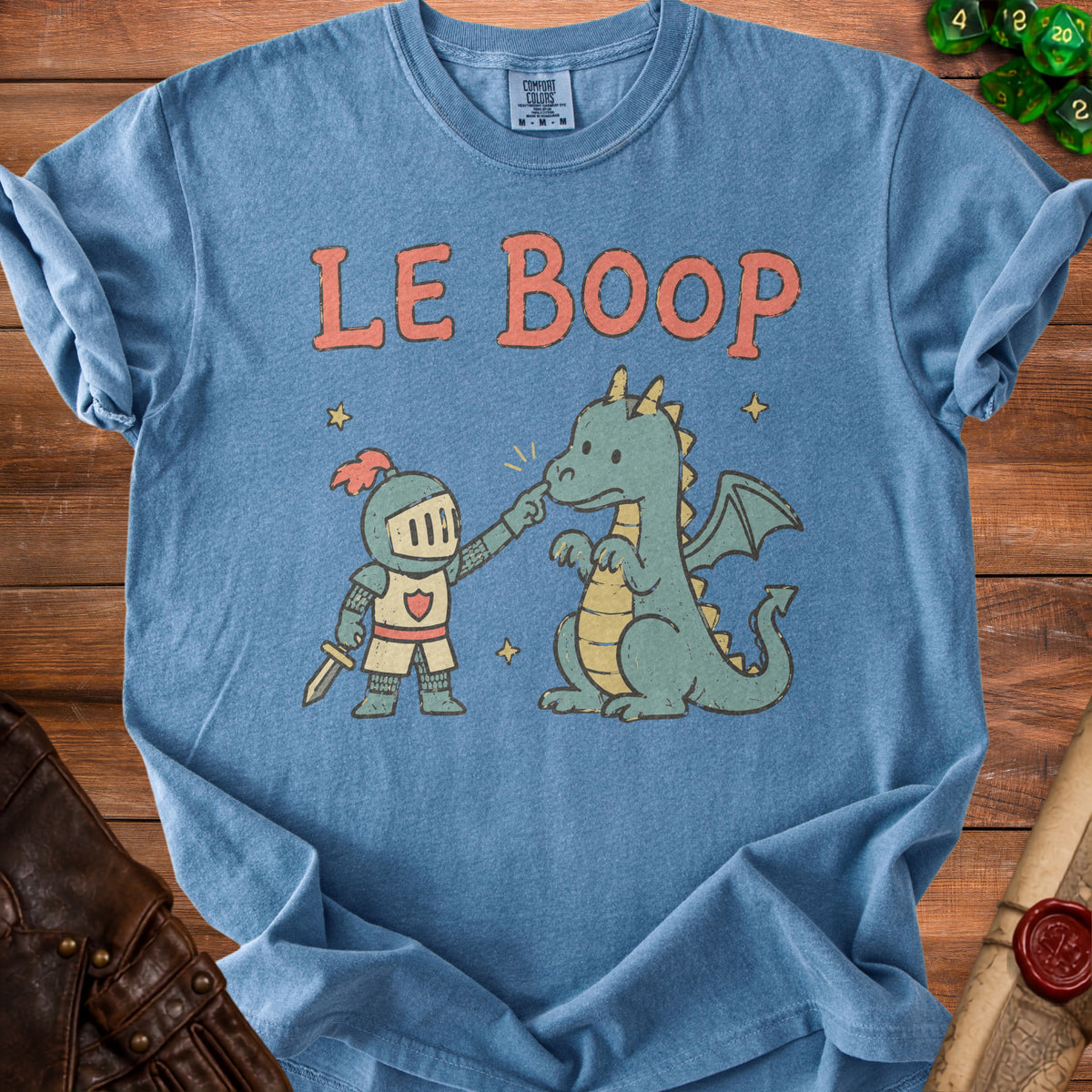 Blue t-shirt with knight booping dragon design and text "LE BOOP".