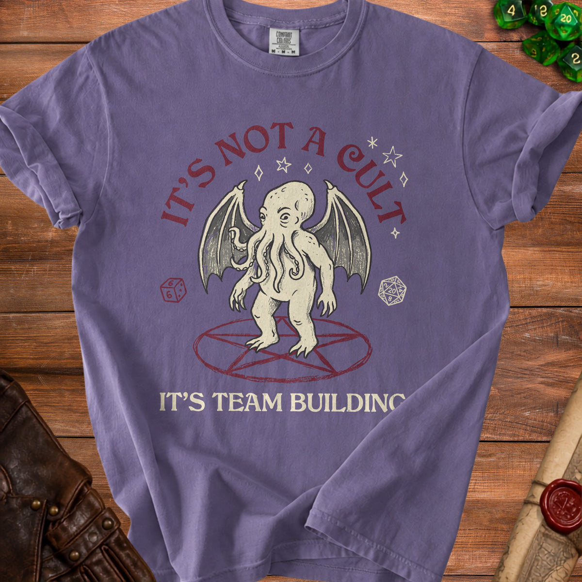Purple t-shirt with "It's Not a Cult, It's Team Building" and Cthulhu graphic.