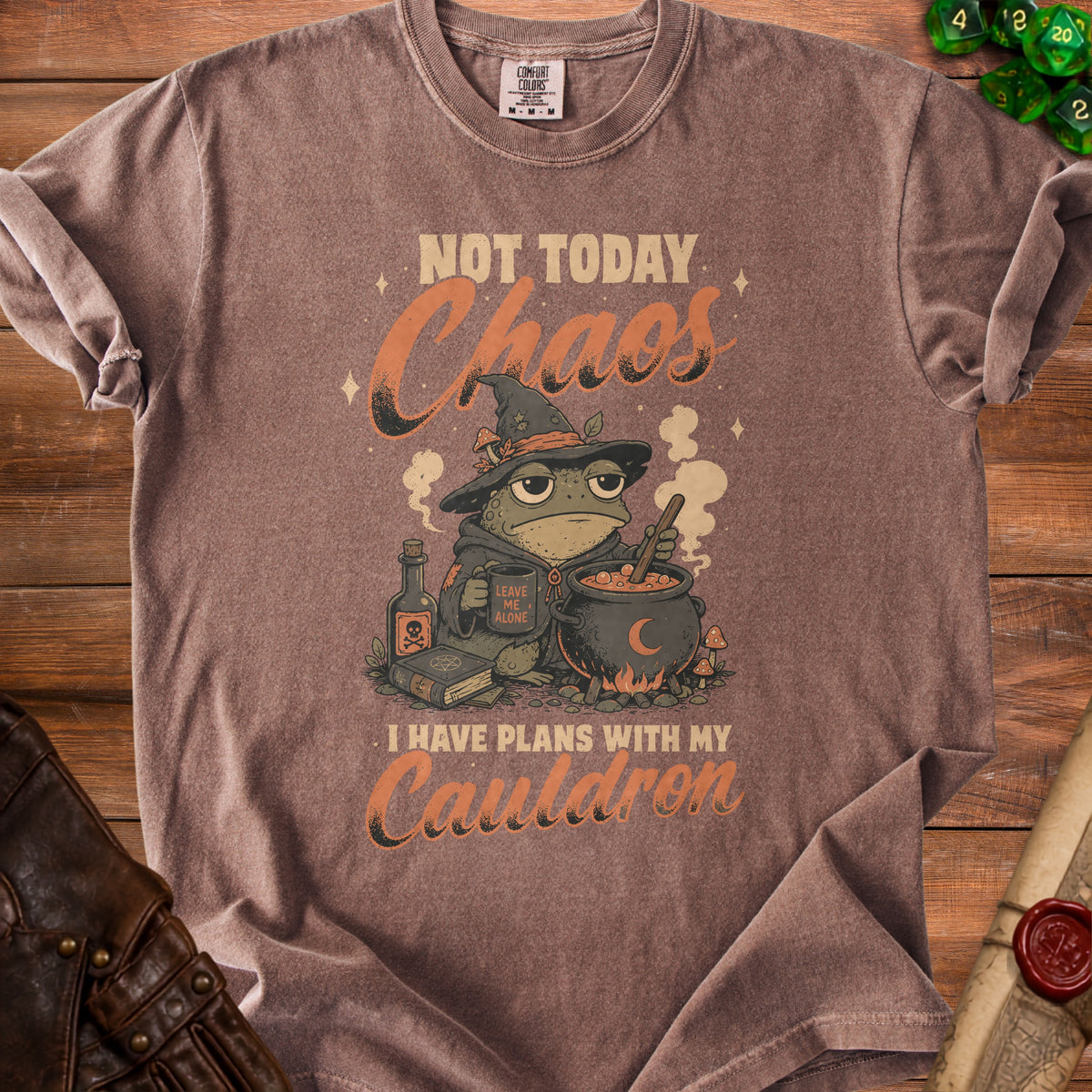 Brown t-shirt with cartoon frog witch and text "Not Today Chaos I Have Plans With My Cauldron".