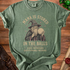 Green t-shirt with wizard graphic: "Mana is stored in the balls. Good intentions, questionable methods."