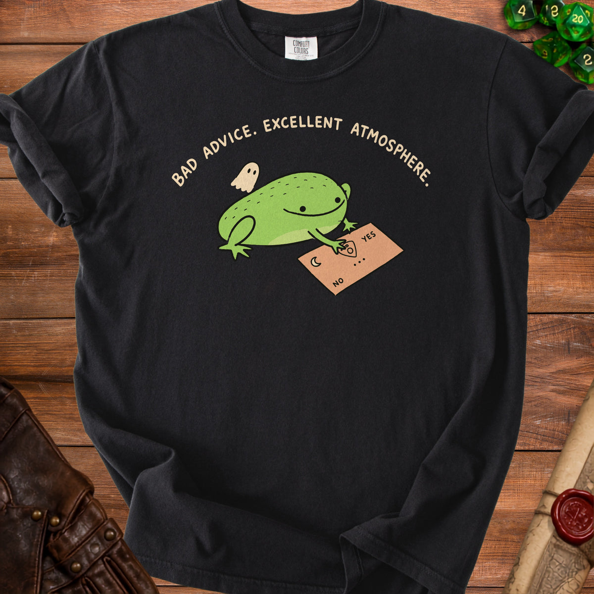 Black t-shirt with a frog, ghost, and Ouija board graphic with text.