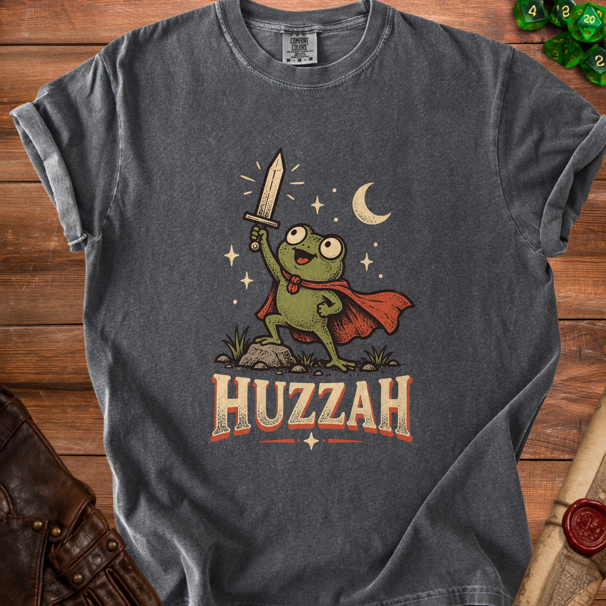 T-shirt with a frog character holding a sword with the word HUZZAH below.