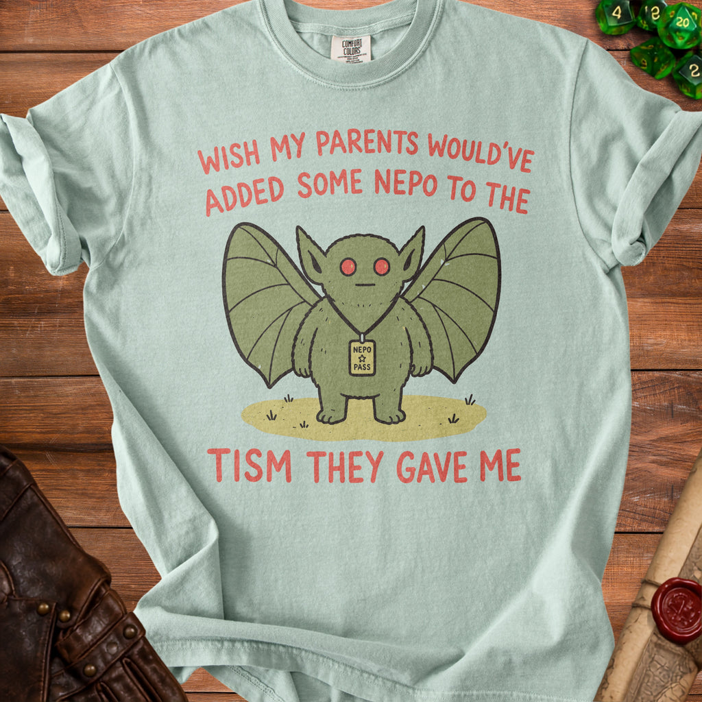 Mint green t-shirt with a cartoon bat graphic and text "Wish my parents would've added some nepo to the tism they gave me."