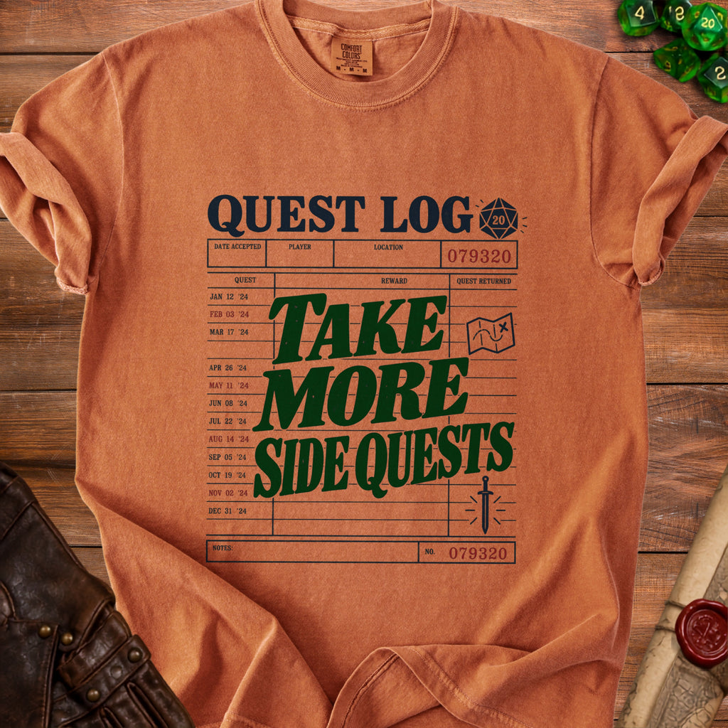 Comfort Colors orange t-shirt with "QUEST LOG" and "TAKE MORE SIDE QUESTS" graphics.