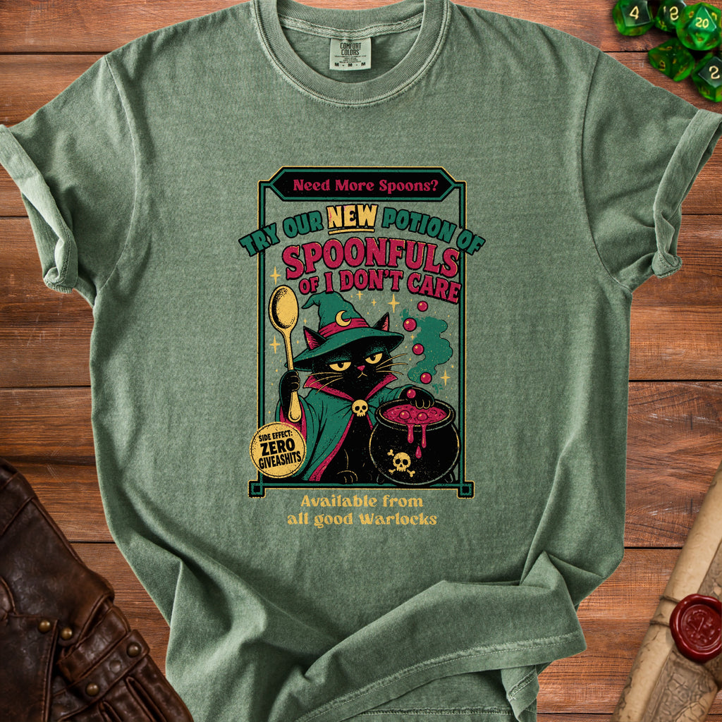 Green t-shirt with a black cat in a wizard hat stirring a cauldron. Text reads "Need More Spoons? Try Our New Potion of Spoonfuls of I Don't Care".