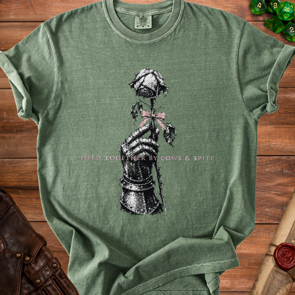 Green t-shirt with a knight's gauntlet holding a rose and text.