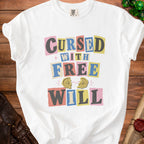 White t-shirt with "CURSED WITH FREE WILL" text and broken compass graphic.
