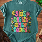 Teal t-shirt with "Side Quests Only Today" in colorful bubble letters.