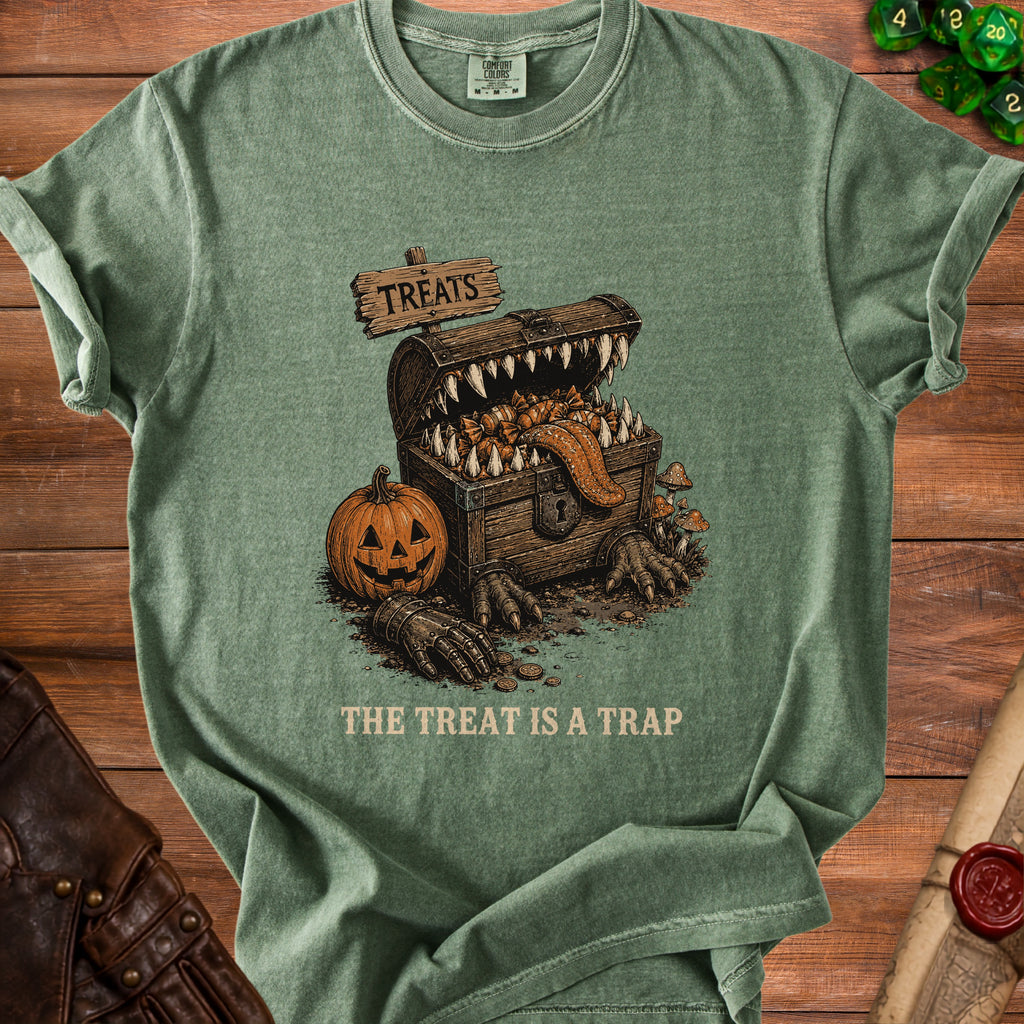 Green t-shirt with a monster chest, pumpkin, and text: "THE TREAT IS A TRAP".