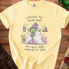 Yellow t-shirt with cartoon Yoda drinking "worry juice" and text "My gut has anxiety too".