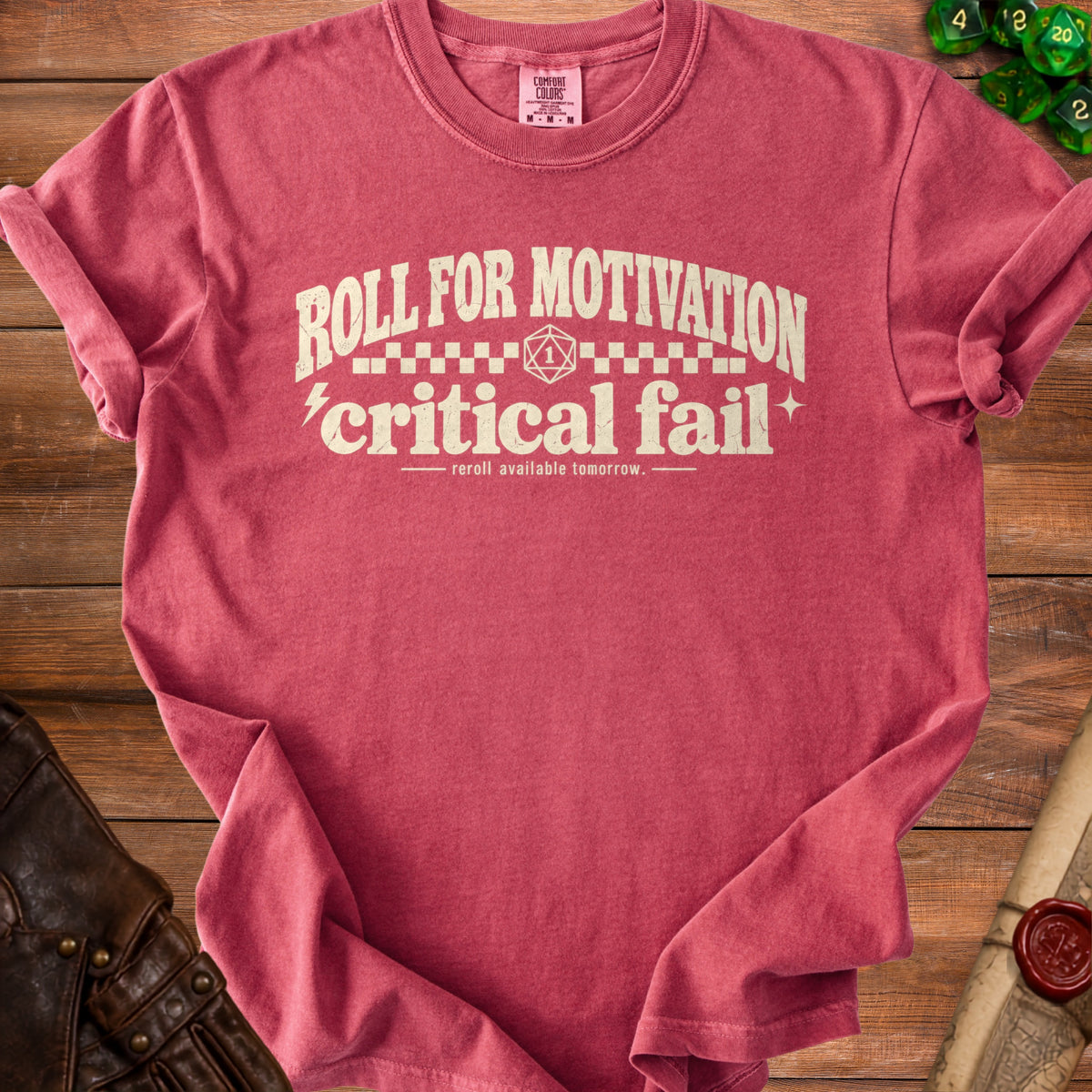 Pink t-shirt with "Roll for Motivation, Critical Fail" text and D20 dice.