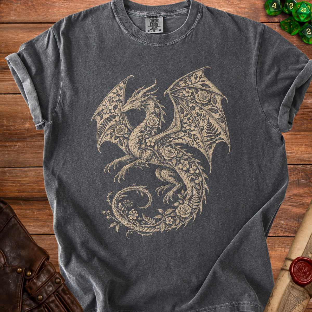 Charcoal grey t-shirt with a cream-colored dragon design filled with flowers and ferns.