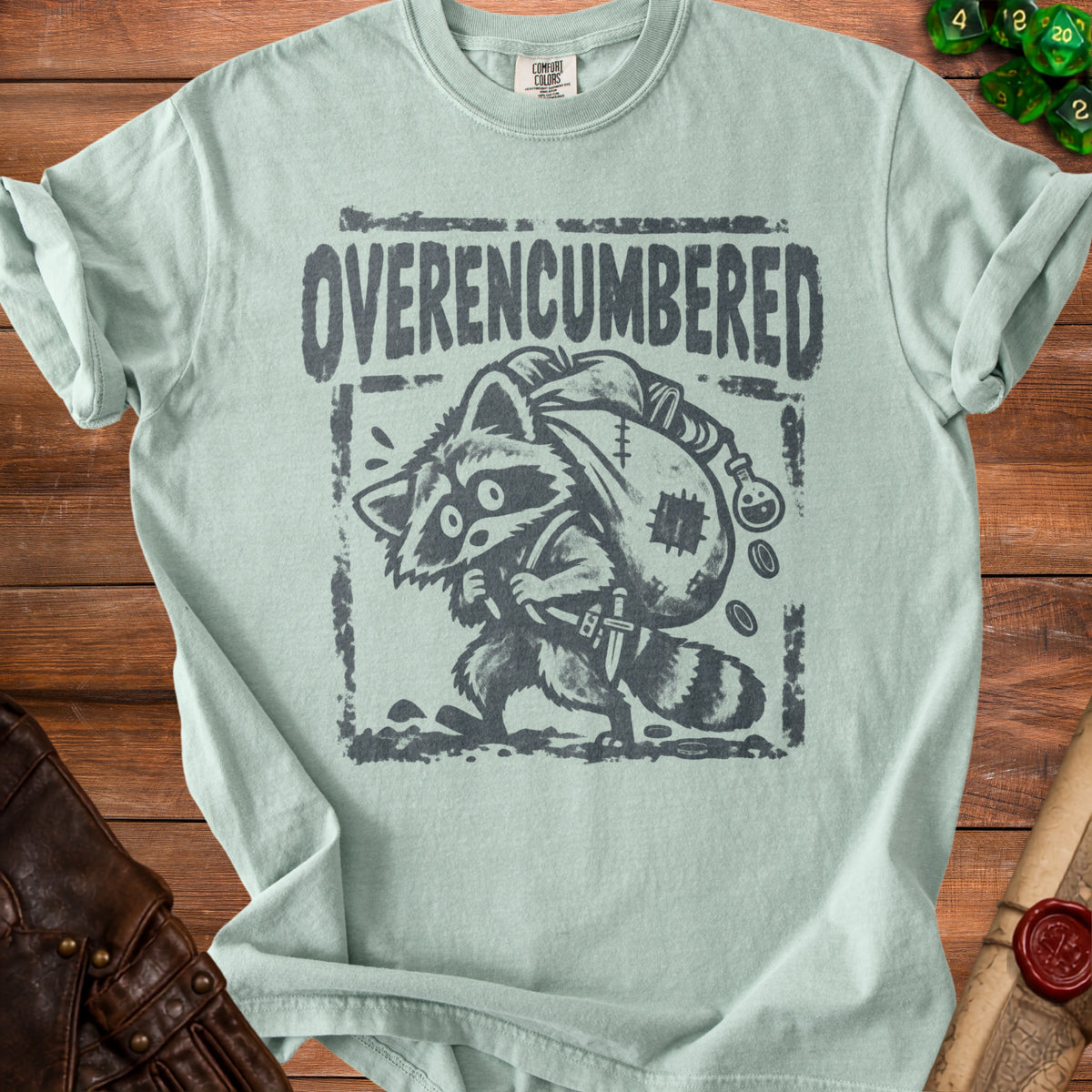 T-shirt with distressed "Overencumbered" text and raccoon graphic.