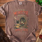 Brown t-shirt with "I gaze at the monster I have become and I love her" text and gothic cat graphic.