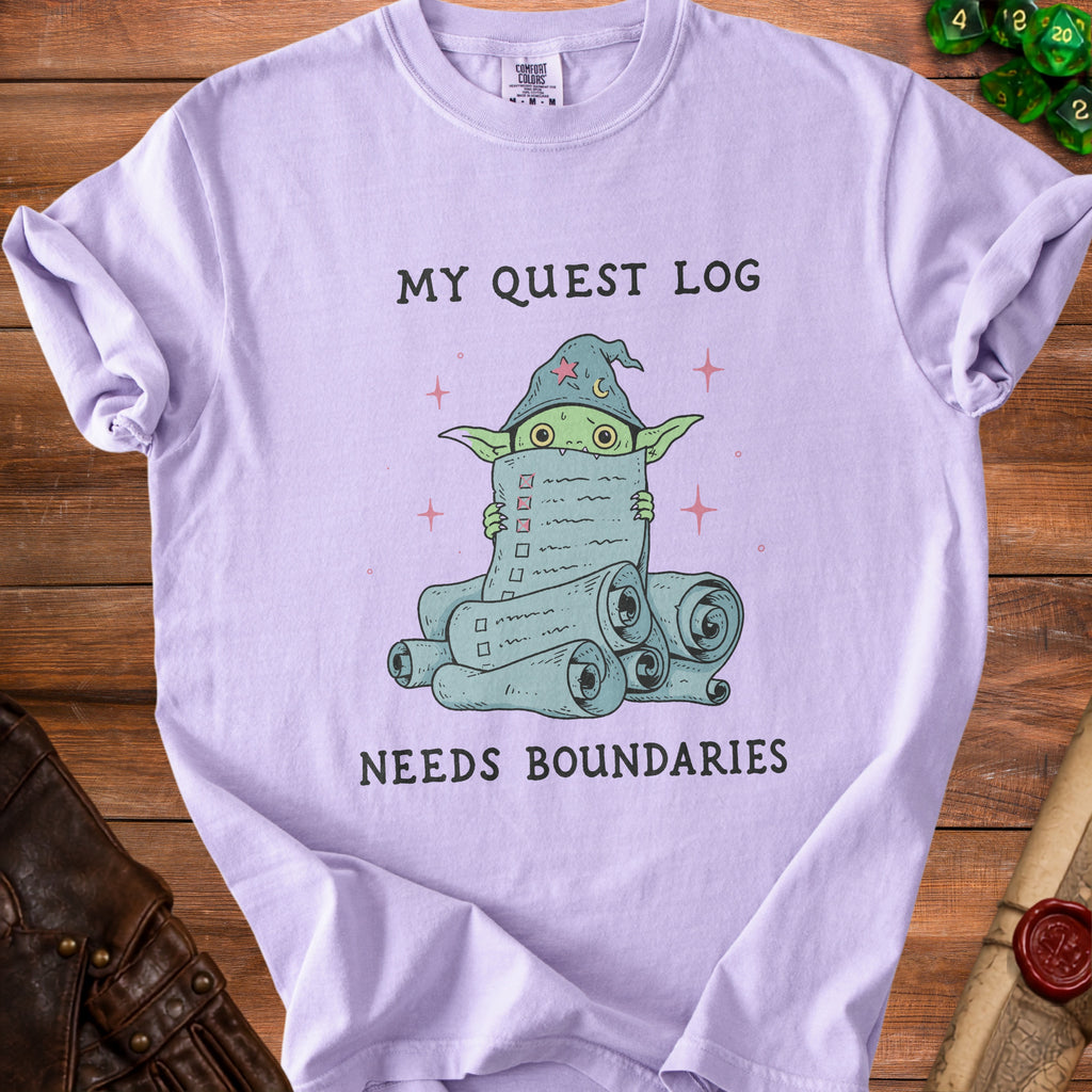 Purple t-shirt with wizard goblin holding a quest log saying "MY QUEST LOG NEEDS BOUNDARIES."