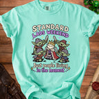 Mint green t-shirt with goblins surrounding a crowned sheep, text reads "Standard Lads Weekend".
