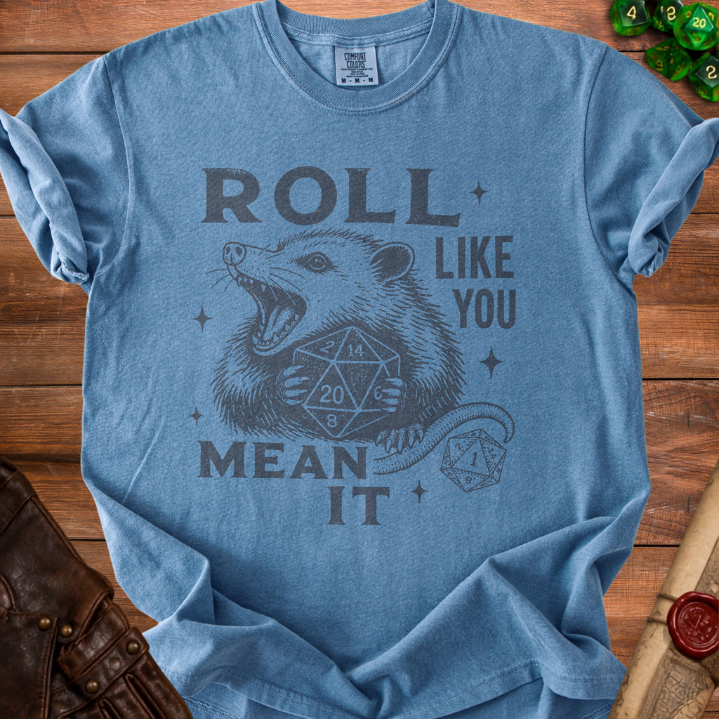 Blue t-shirt with opossum graphic and dice. "Roll like you mean it."