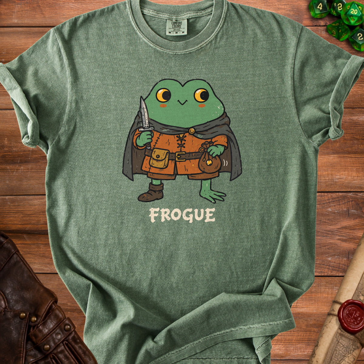 Green t-shirt with a cartoon frog wearing adventuring gear and the text "FROUGE".