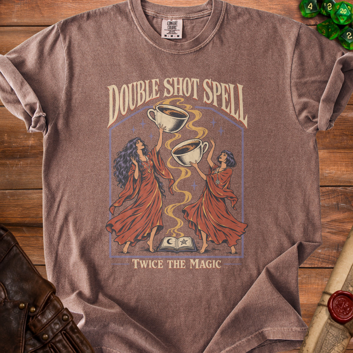 Brown t-shirt with "Double Shot Spell Twice The Magic" and two witches holding coffee.