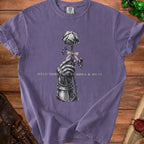 Purple t-shirt with graphic of armored hand holding a rose with text "HELD TOGETHER BY BOWS & SPITE".