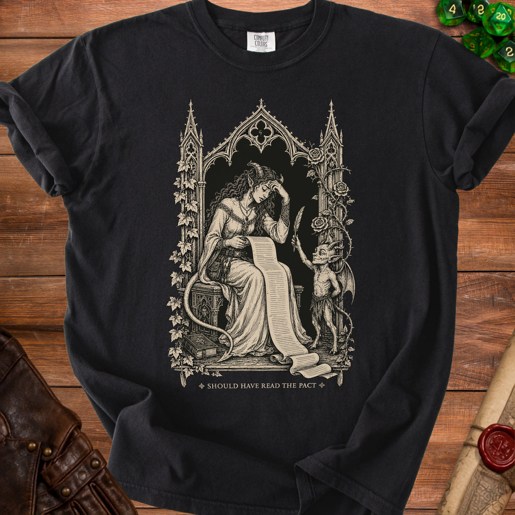 Black t-shirt with gothic art of a woman reading a scroll and a demon holding a quill.