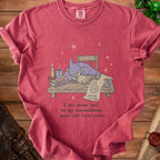 Red t-shirt with a cartoon wizard goblin sleeping at a desk.