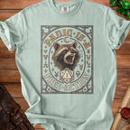 Mint green t-shirt with raccoon, dice, and text "Panic is Free Action".