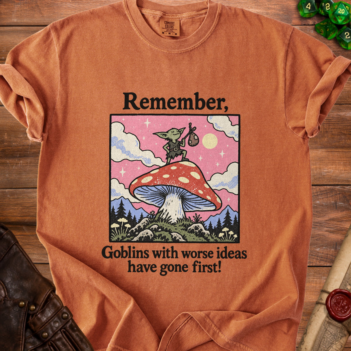 Orange t-shirt with "Remember, Goblins with worse ideas have gone first!" text and goblin graphic.