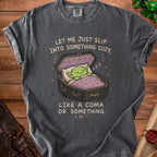 Gray t-shirt with a green goblin sleeping in a coffin and text that reads "Let me just slip into something cozy, like a coma or something."