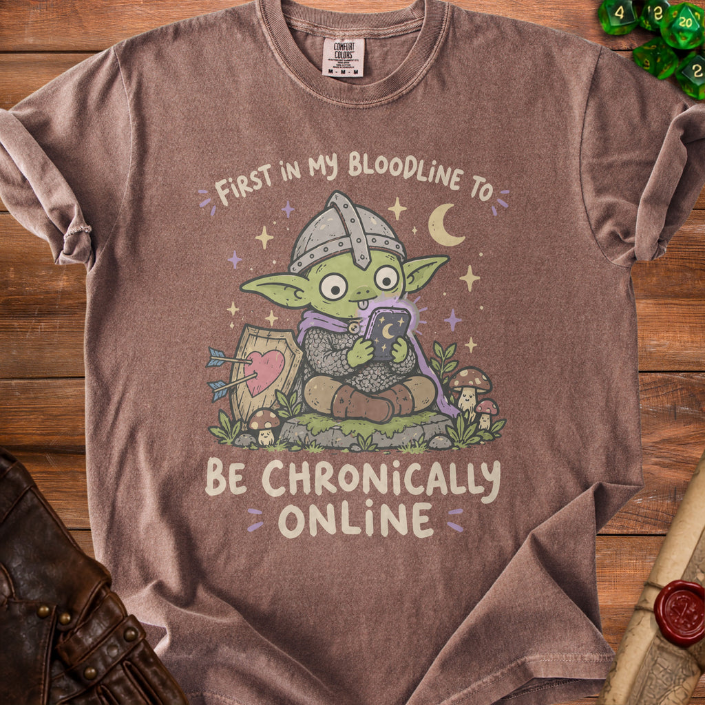 T-shirt with a cartoon goblin knight holding a phone and the text "First in my bloodline to be chronically online."