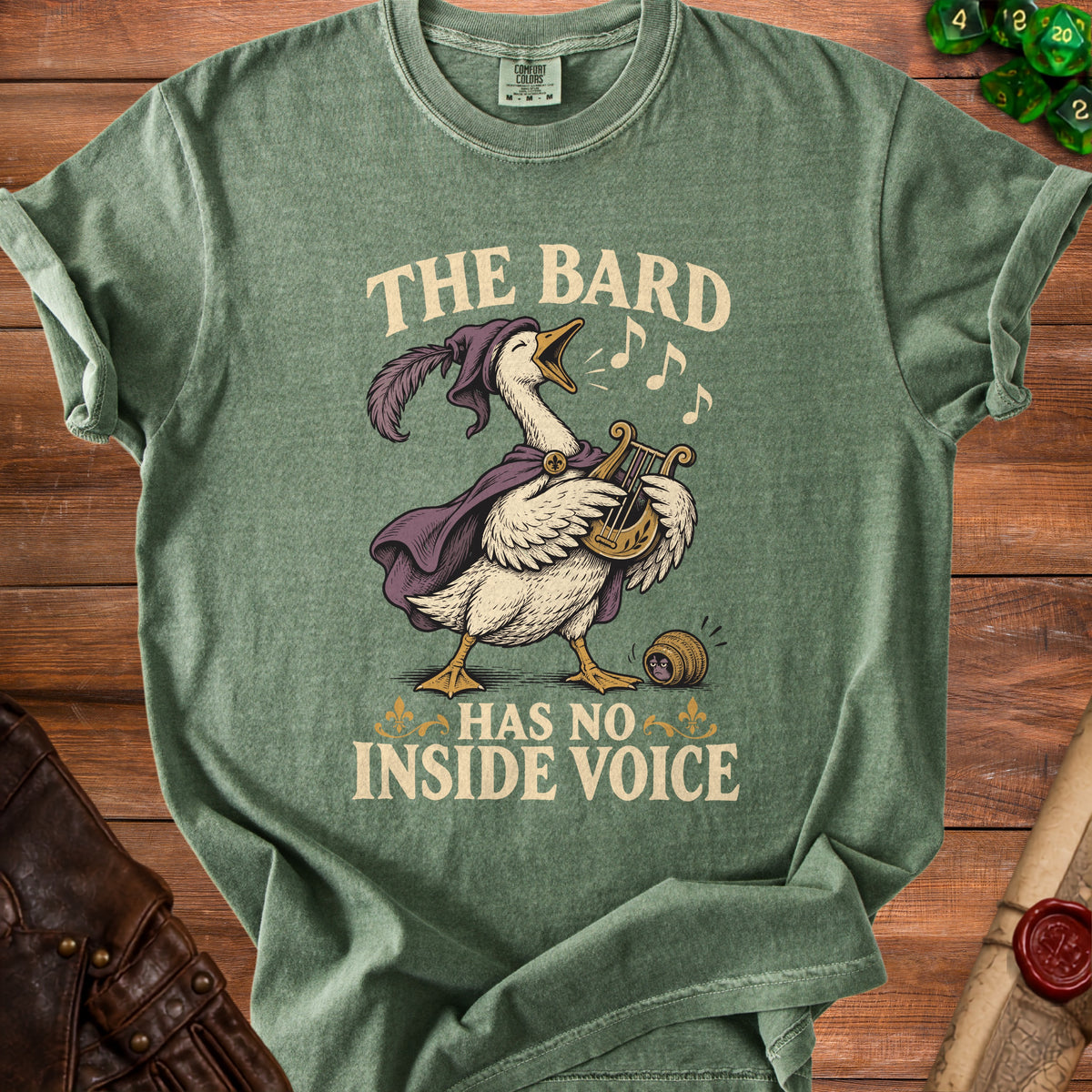 Green t-shirt with a goose playing a lyre and text that reads "The Bard Has No Inside Voice".