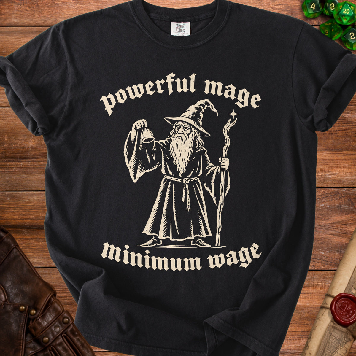 Black t-shirt with a wizard holding a pouch and staff, text "powerful mage minimum wage".