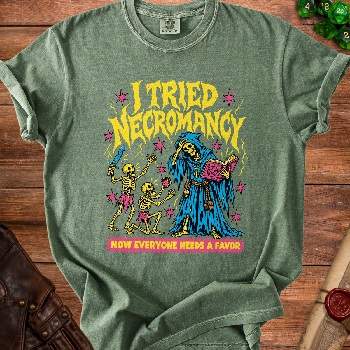 Green t-shirt with "I Tried Necromancy" text and skeleton graphics.