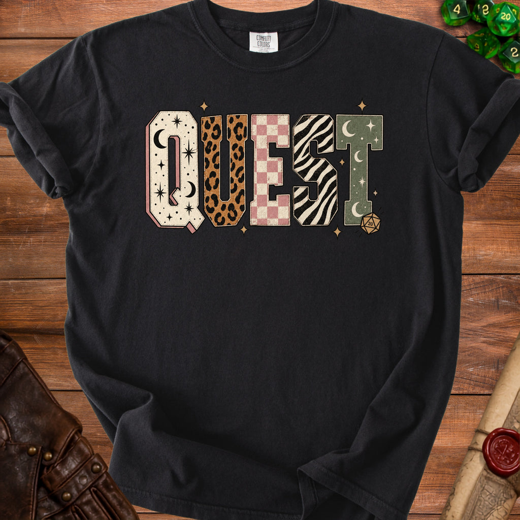 Black t-shirt with the word QUEST in patterned block letters and dice graphics.