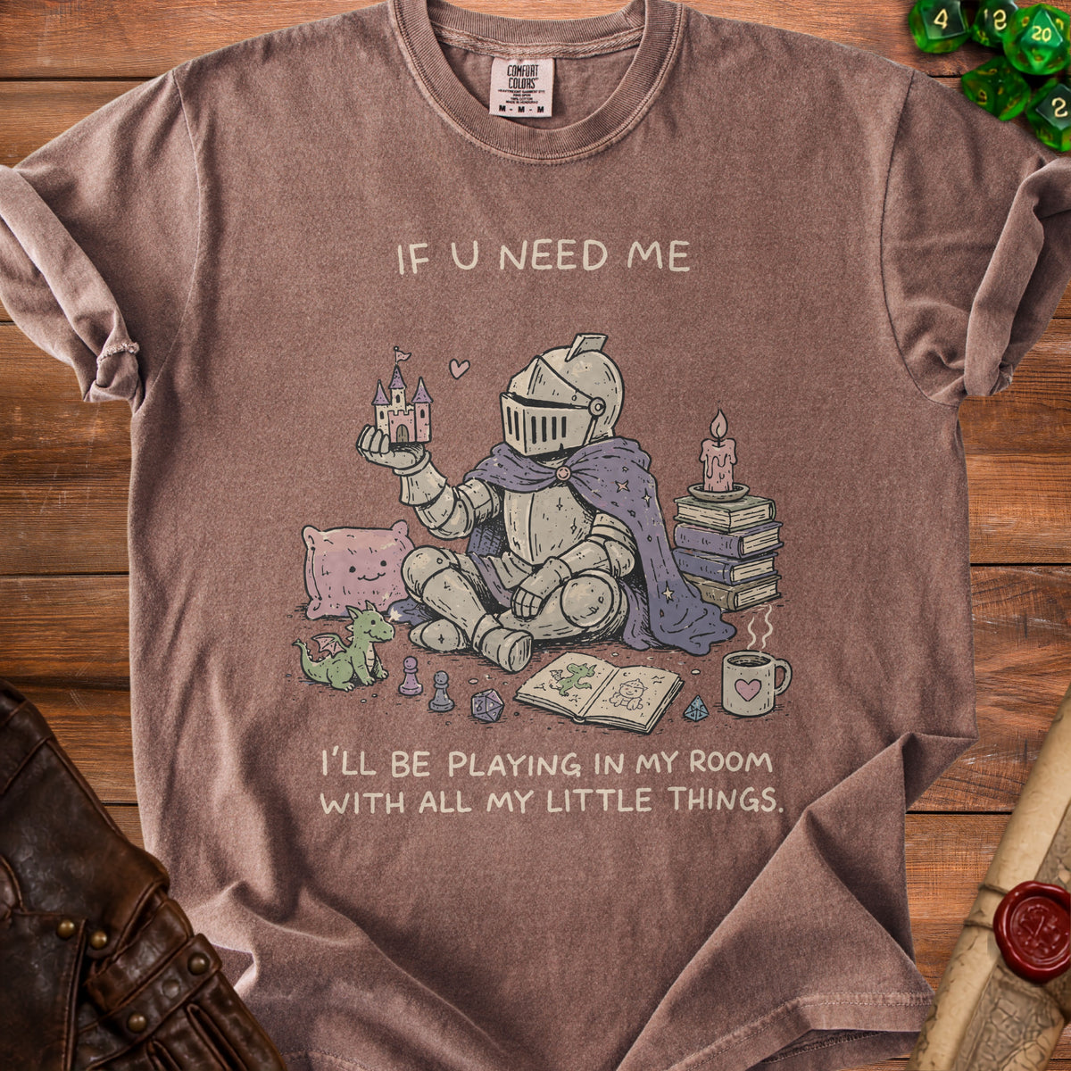 Brown t-shirt with knight holding castle and text "IF U NEED ME, I'LL BE PLAYING IN MY ROOM WITH ALL MY LITTLE THINGS."