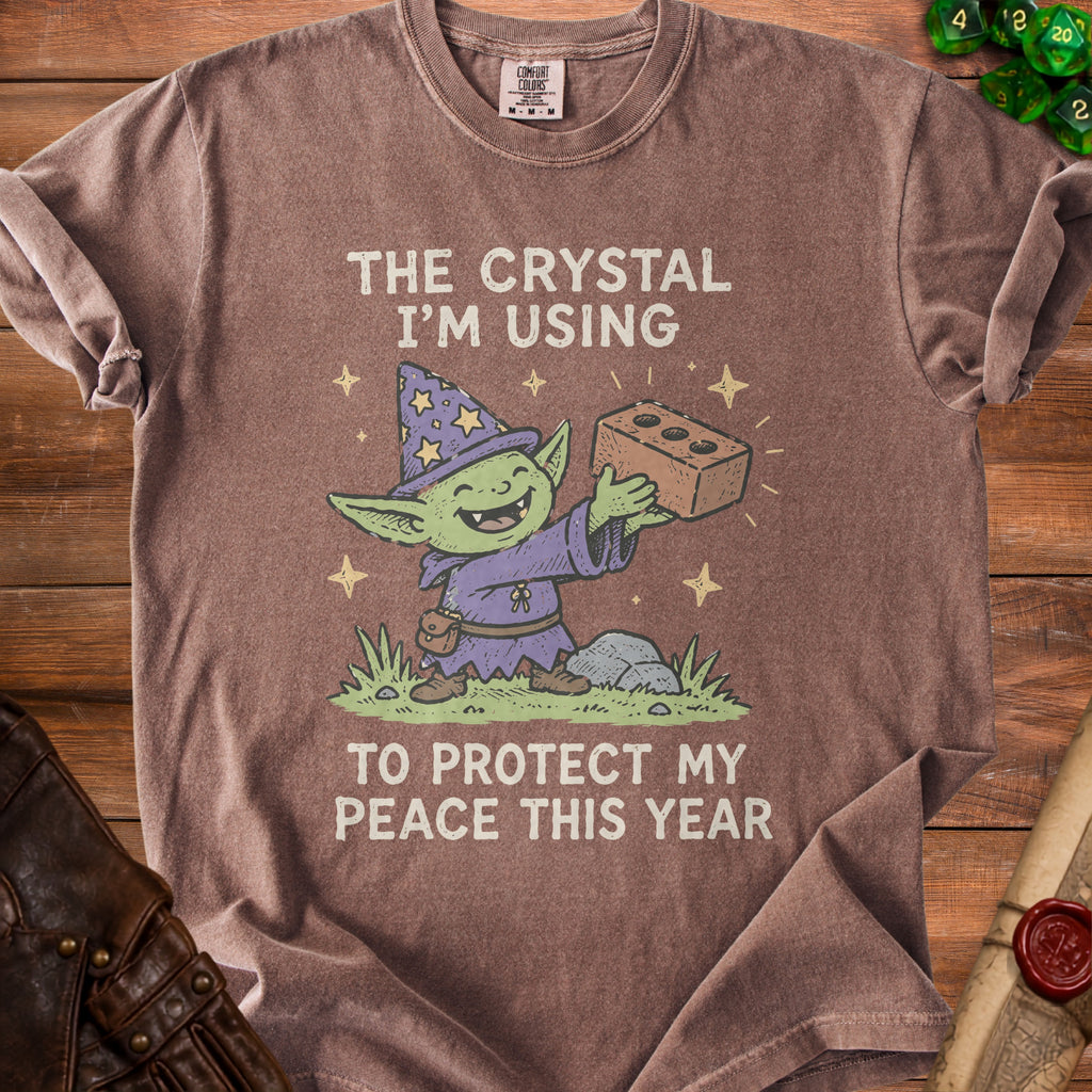 Goblin wizard holding a brick with text: "The crystal I'm using to protect my peace this year."
