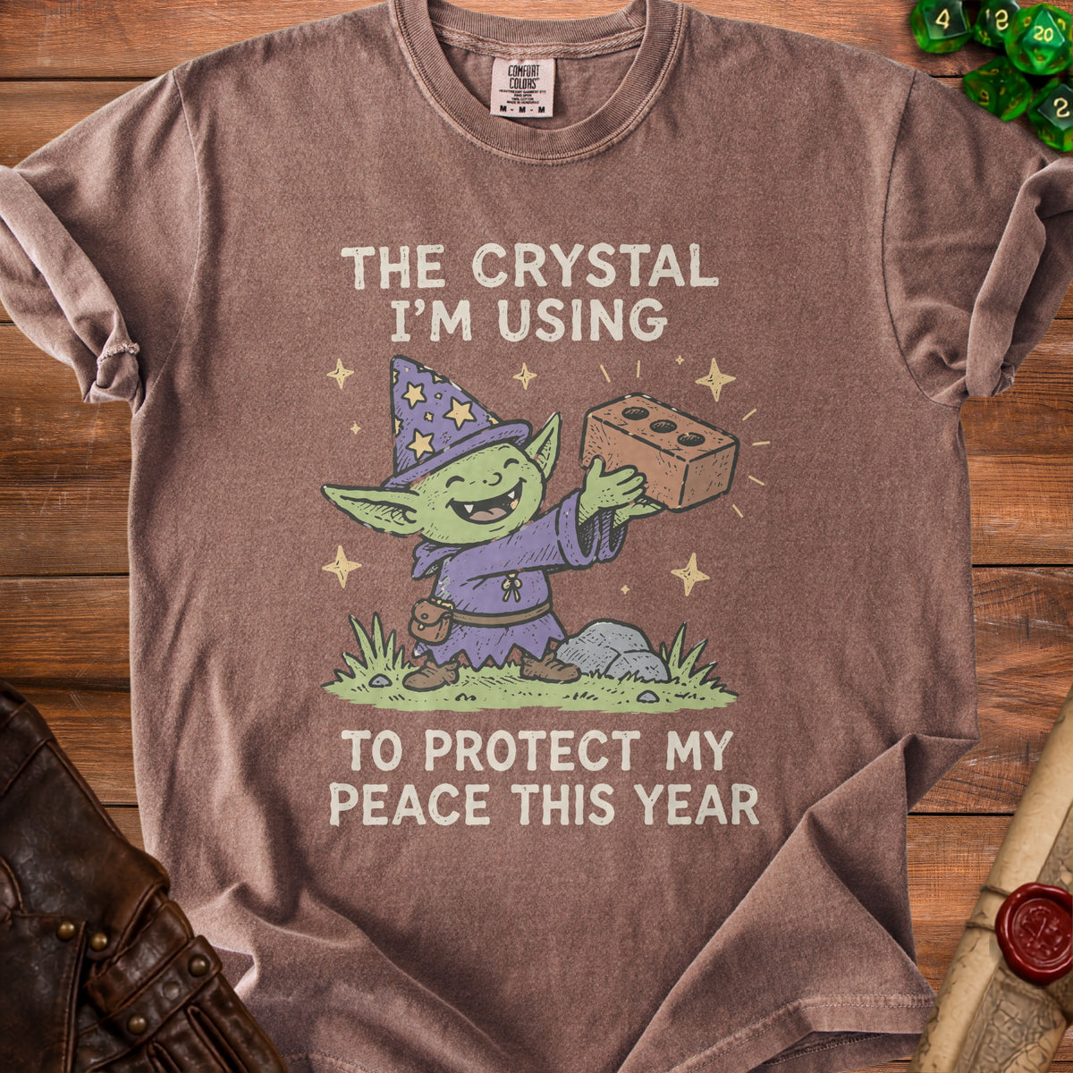 Goblin wizard holding a brick with text: "The crystal I'm using to protect my peace this year."