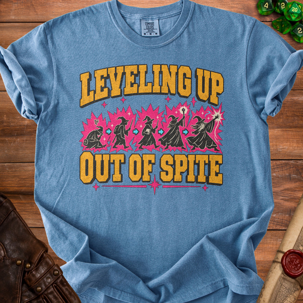 Blue t-shirt with "Leveling Up Out of Spite" text and wizard illustrations.