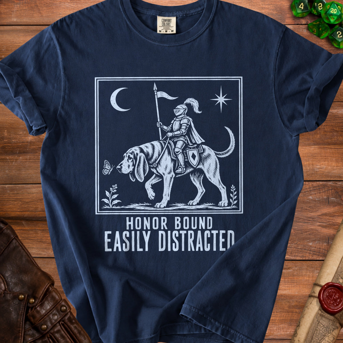 Dark navy t-shirt with knight on dog graphic and text "Honor Bound Easily Distracted".