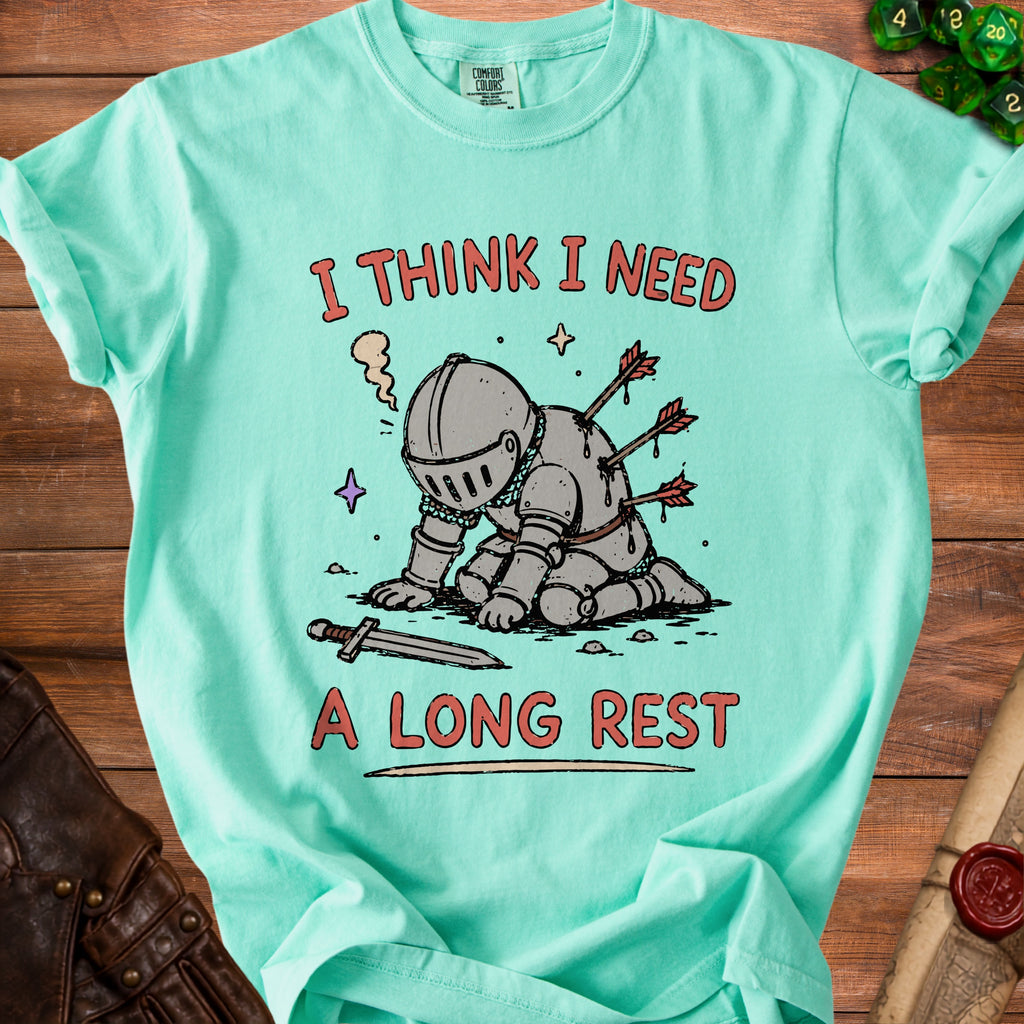 Mint green t-shirt with a knight pierced by arrows and text "I THINK I NEED A LONG REST".