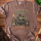 Brown t-shirt with a witch frog, cauldron, and text "I Yearn for the Bog, Become Ungovernable".