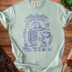 Light green t-shirt with "Hermit essentials" and fantasy illustrations.