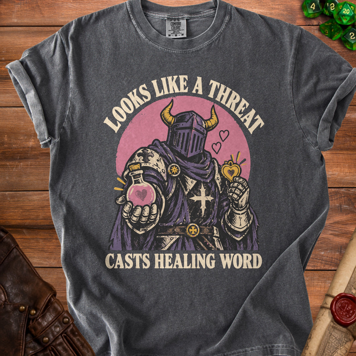 Dark grey t-shirt with knight holding potion and saying "Looks Like A Threat Casts Healing Word".