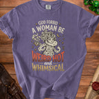 Purple t-shirt with "God forbid a woman be weird hot and whimsical" text and mystical graphic.