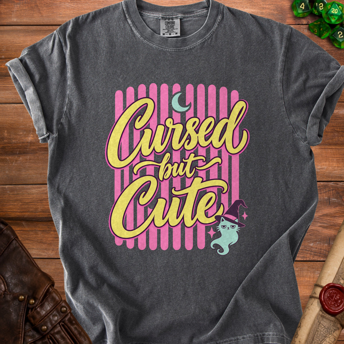 Dark gray t-shirt with "Cursed but Cute" text and a witch cat.