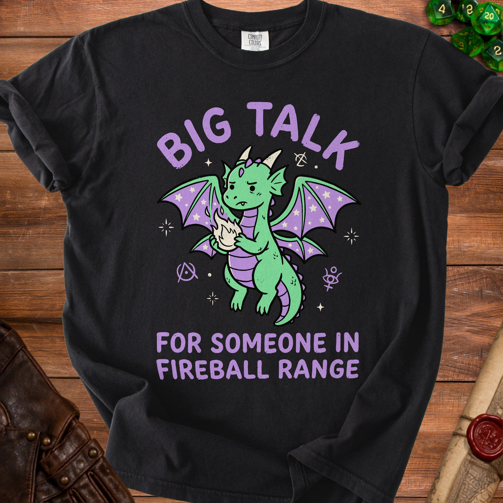 Black t-shirt with a cartoon dragon holding fire and text "BIG TALK FOR SOMEONE IN FIREBALL RANGE".