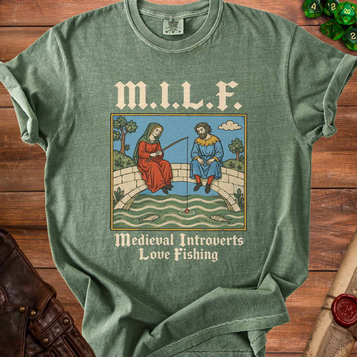 Green t-shirt with medieval illustration of people fishing and text "M.I.L.F. Medieval Introverts Love Fishing".